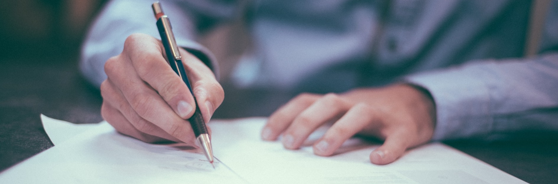 Image of person working on finances
